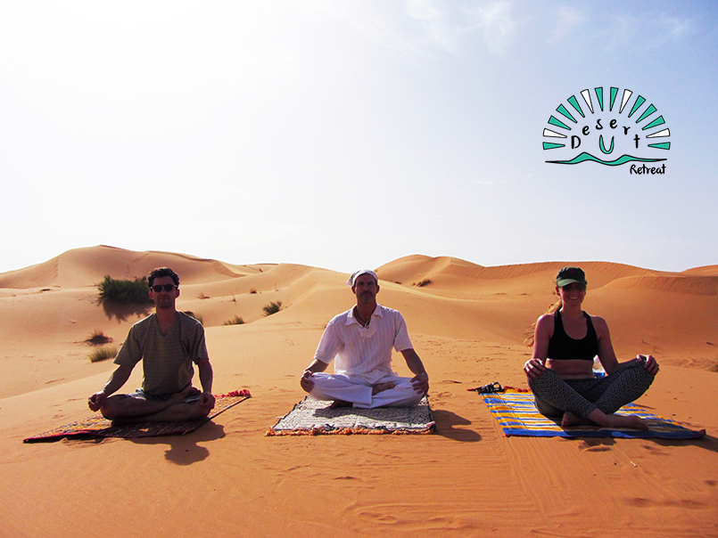 three yogis meditating in the desert, sahara morocco