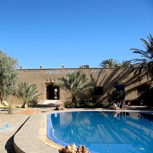 pool in traditional earth building in the sahara desert, morocco, desert u retreat