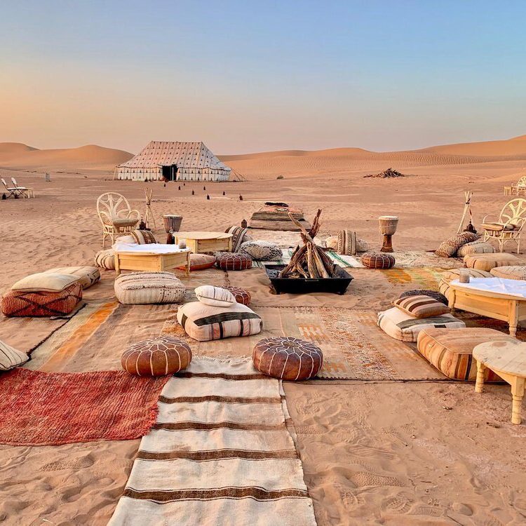 berber nomad tent with pillows on ground in morocco, sahara desert, erg chebbi